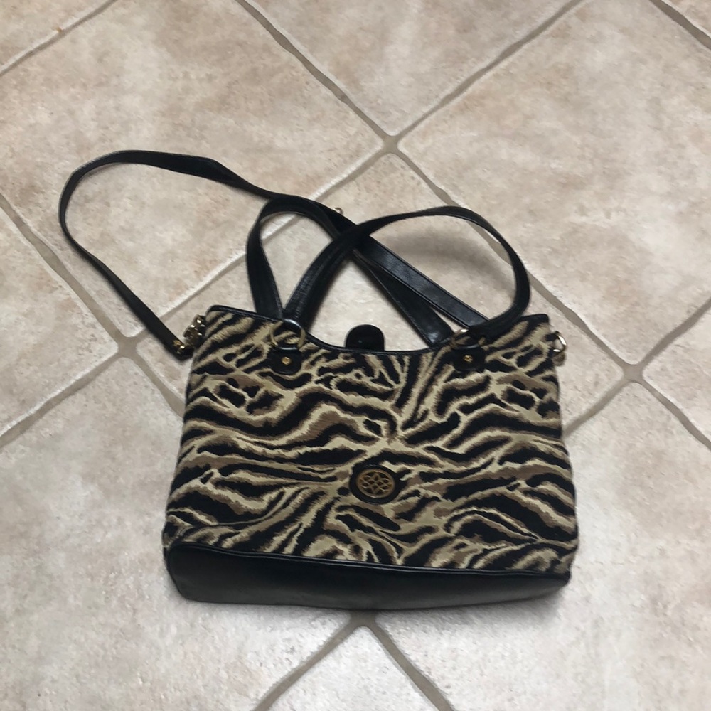 Used bag some stains might be able to clean up also tear